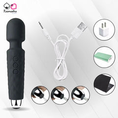 Black handheld electronic device with USB cable and charging adapter on a white background