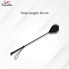 Black feather duster with total length measurement on a white background