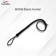 Black leather whip labeled 'BDSM Black Hunter' on a white background with 'Kaamastra' branding.