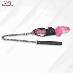 Pink chastity device with black chain and leather strap on a white background, branded 'Kaamastra'.