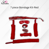 Red 7-piece bondage kit with various items on a white background