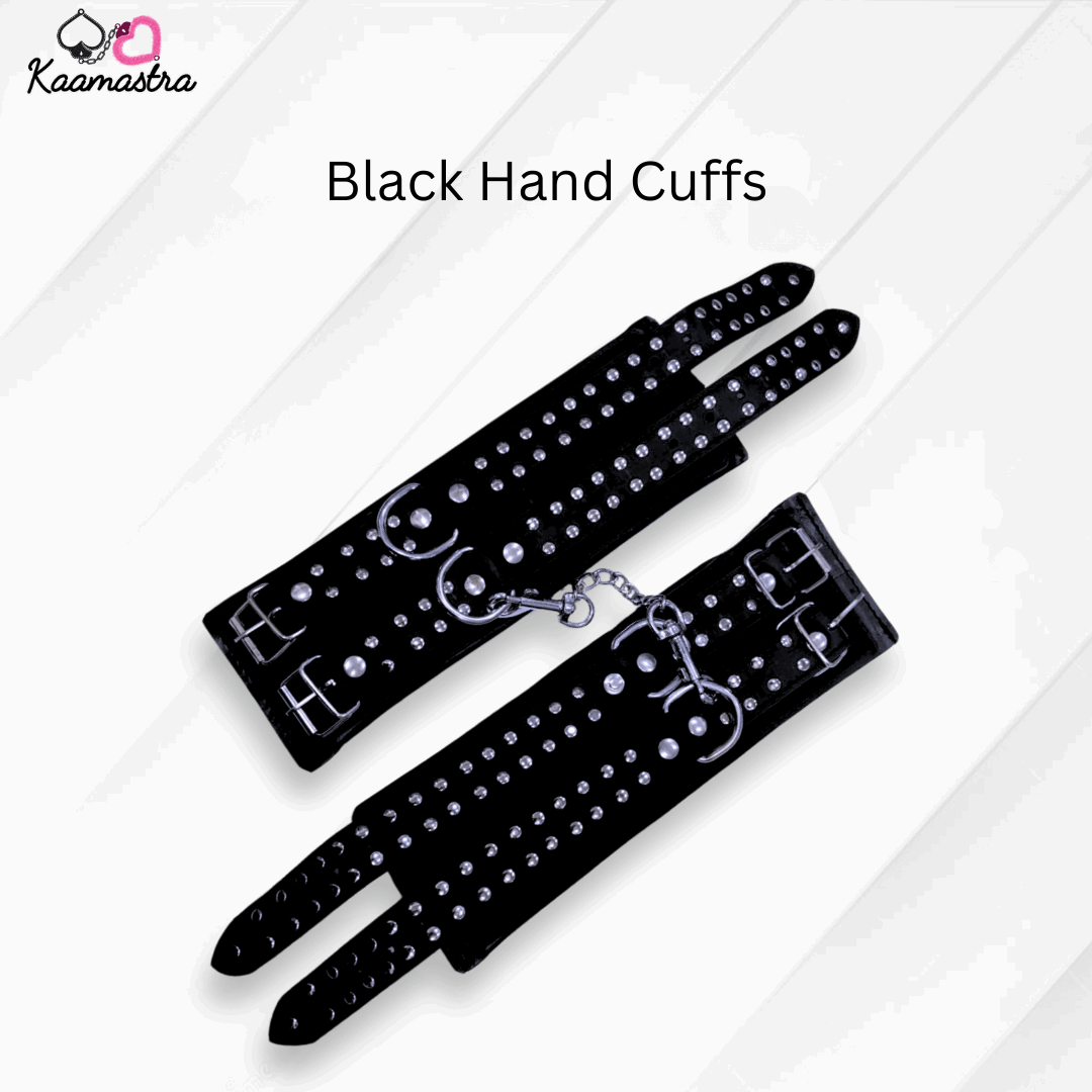 Black hand cuffs with rhinestones on a white background, branded 'Kaamastra'.