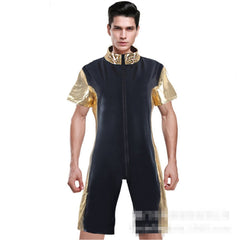 A man modeling a black and gold Kaamastra Fatal Attraction Front Zip Men's Catsuit with short sleeves and a gold neck.