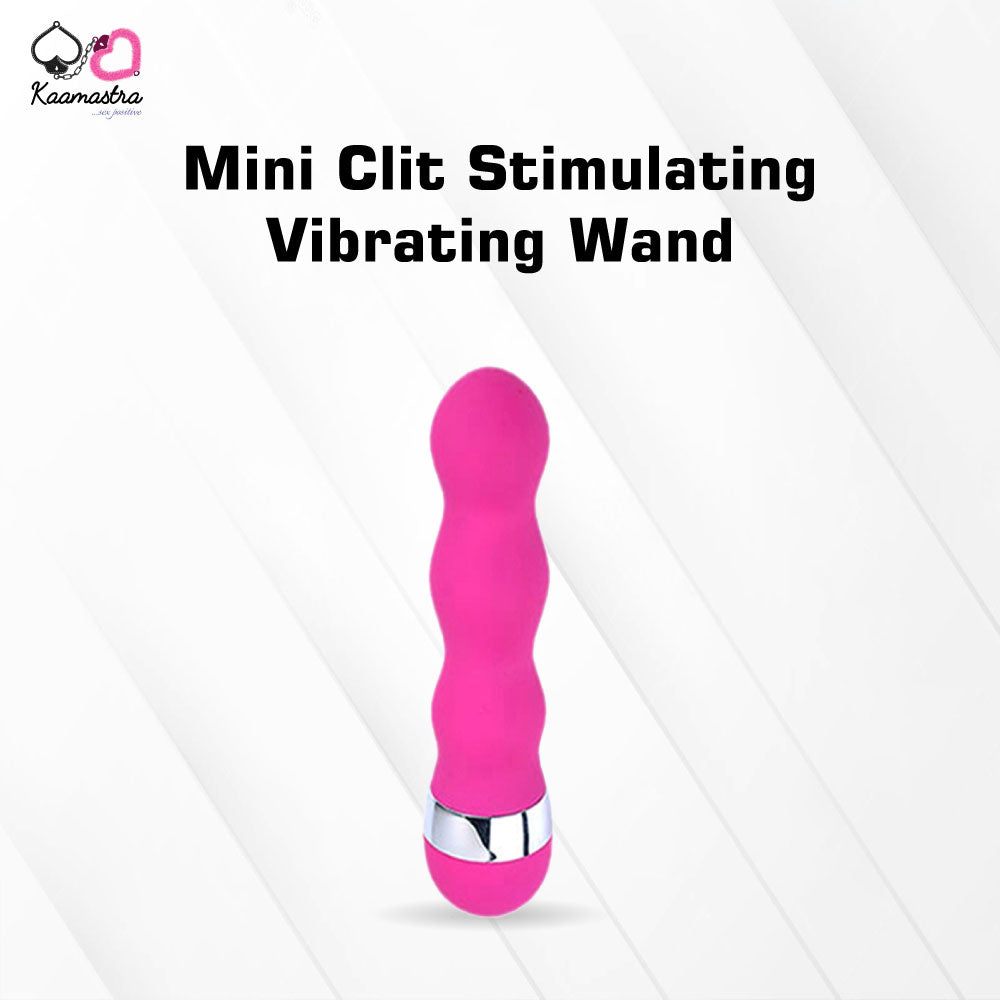 Mini Clit Stimulating Vibrating Wand in pink with chrome base