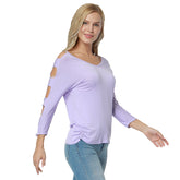 A woman wearing a purple V-neck top with full sleeves and a cutout detail on the front.