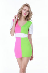A model wearing a short-sleeved mini dress with green, pink, and white colors.