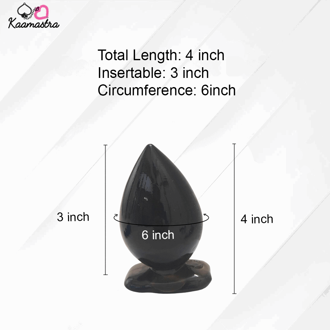 Black drop-shaped object with measurements on a white background