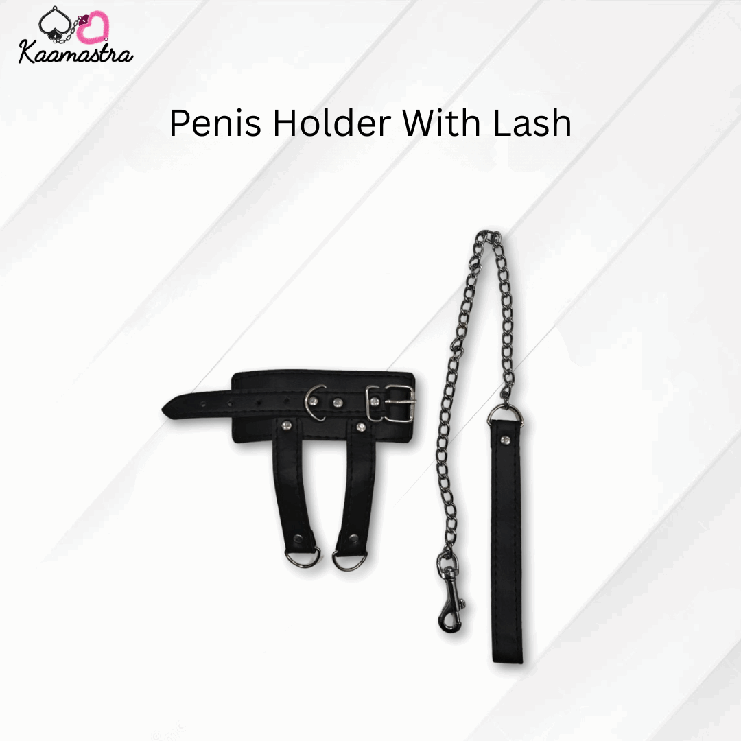 Black penis holder with chain and lash on a white background, branded 'Kaamastra'.