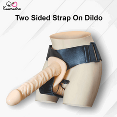 Two-sided strap on dildo with 'Kaamastra' branding on a white background