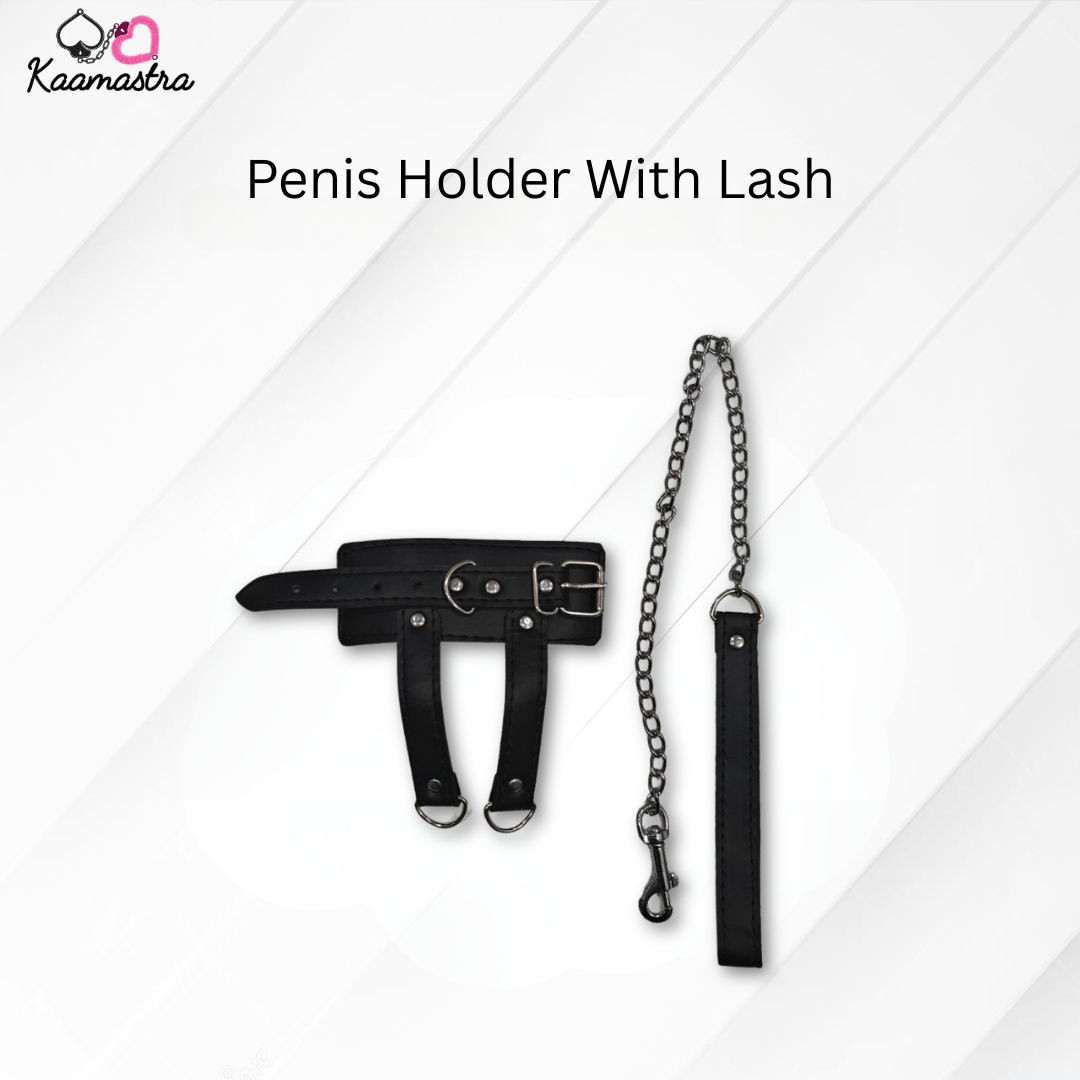 Black penis holder with chain and lash on a white background, branded 'Kaamastra'.