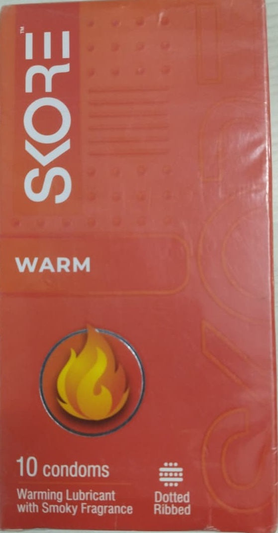 Skore Warm condoms packaging with flame icon on a red background