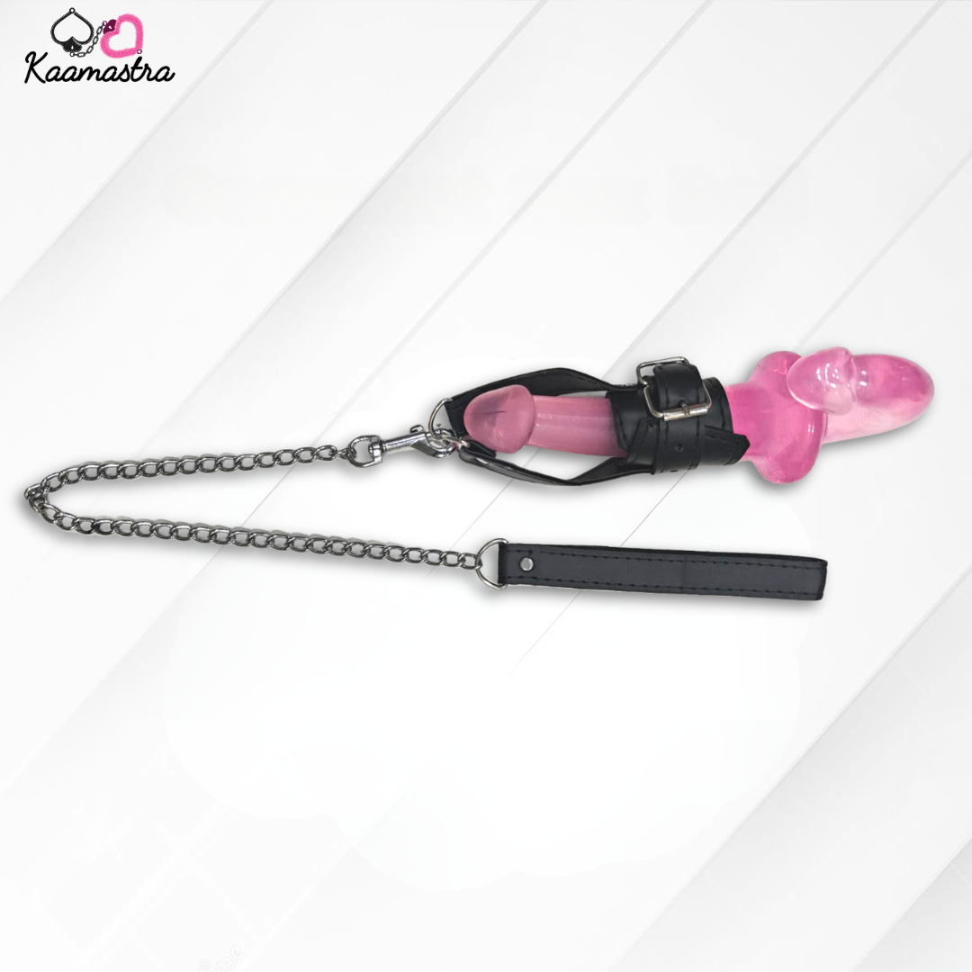Pink chastity device with black chain and leather strap on a white background, branded 'Kaamastra'.