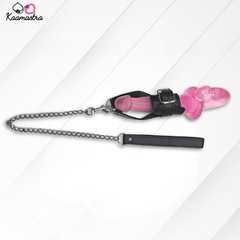 Pink chastity device with black chain and leather strap on a white background, branded 'Kaamastra'.