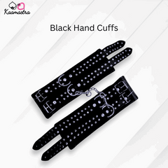 Black hand cuffs with rhinestones on a white background, branded 'Kaamastra'.