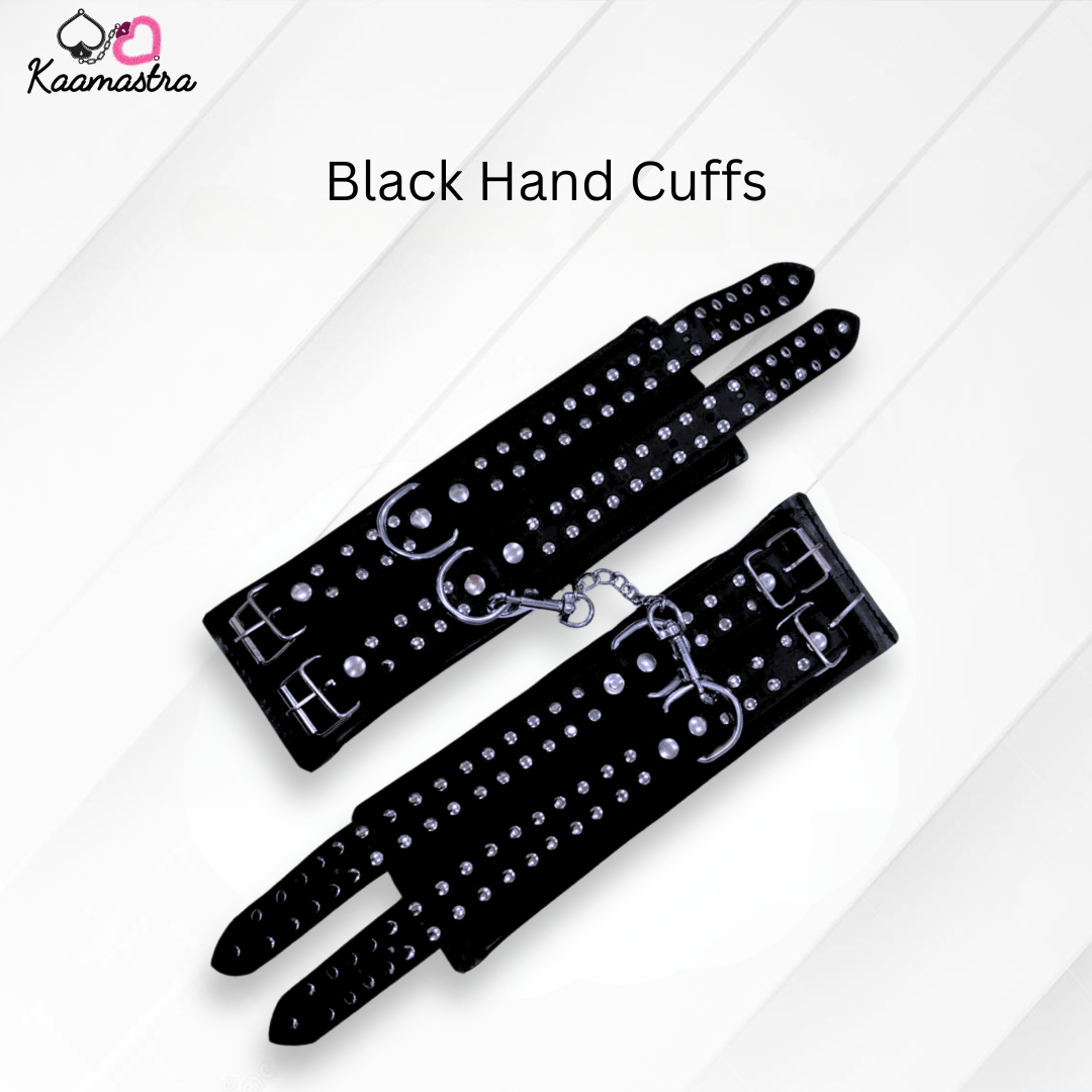Black hand cuffs with rhinestones on a white background, branded 'Kaamastra'.