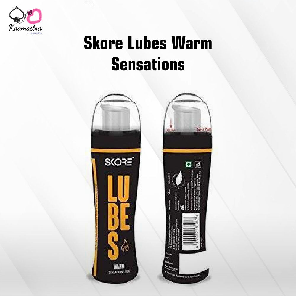 Two bottles of Skore Warm Sensation Lubricant, one standing upright and the other lying down, against a white background with black and orange labeling.